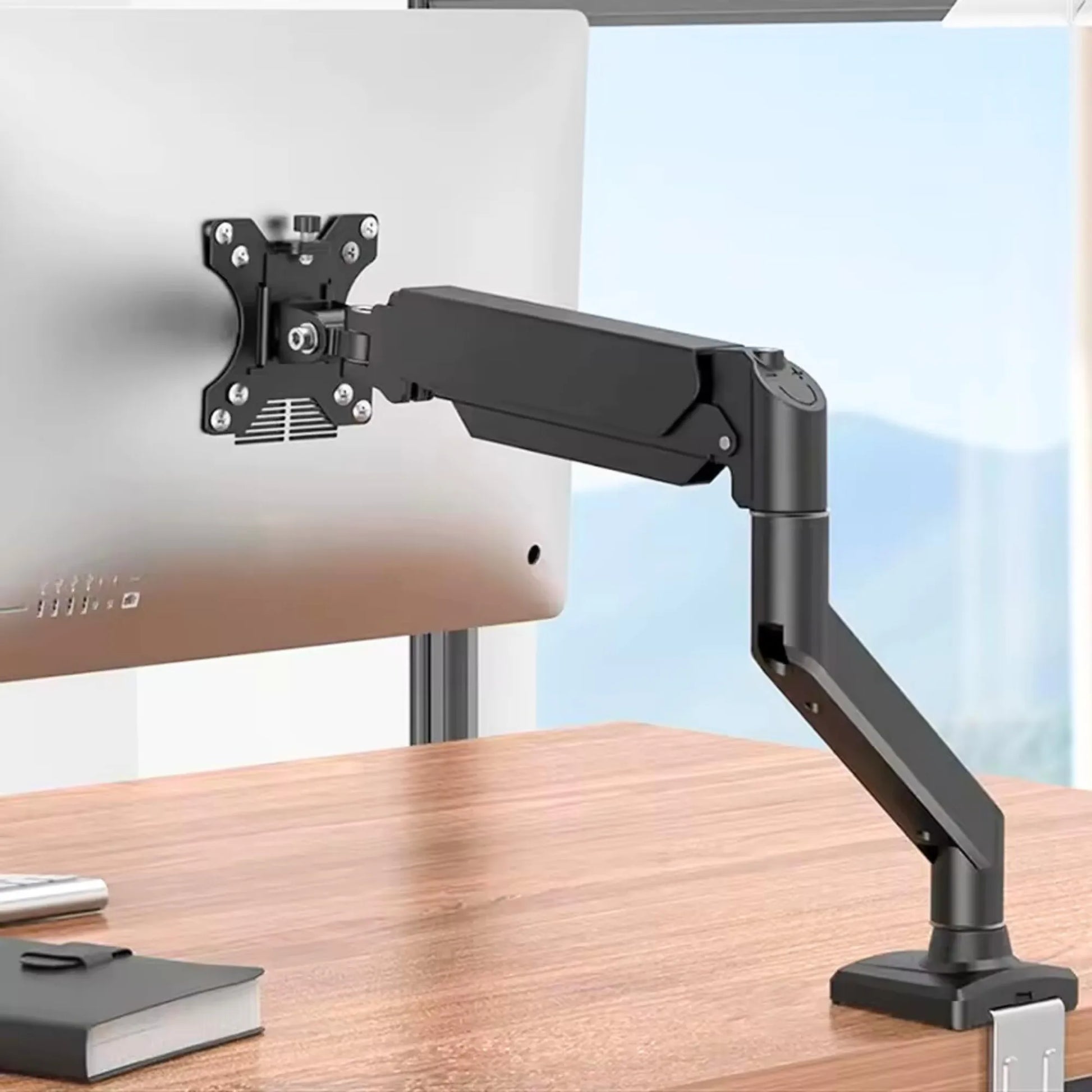 ScreenFix Monitorarm mit iMac im ergonomischen Einsatz auf Holz Schreibtisch im Homeoffice